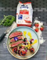 Quaker Oats Herb crusted Ribeye steak with Japanese pumpkin puree, served with balsamic honey infused Strawberries and blueberries, Cherry red wine sauce